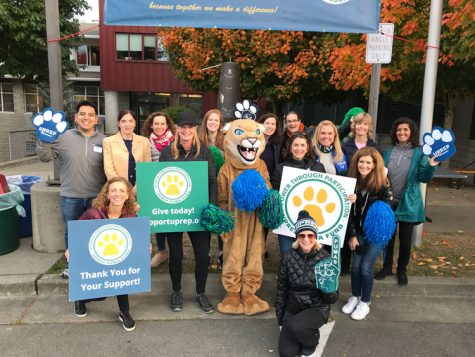 The Advacement Office works with parent volunteers to encourage donation in the Puma Fund one morning in front of UPrep. 