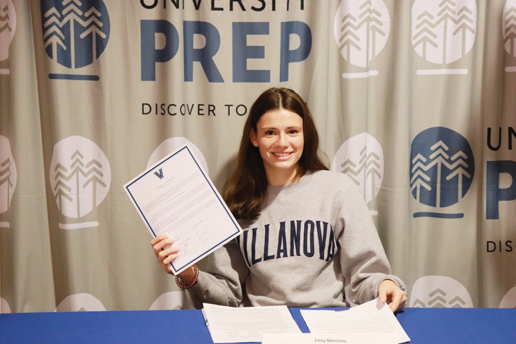 Senior Emily Morrissey signs her letter of intent for Villanova. She will play on their soccer team next year.