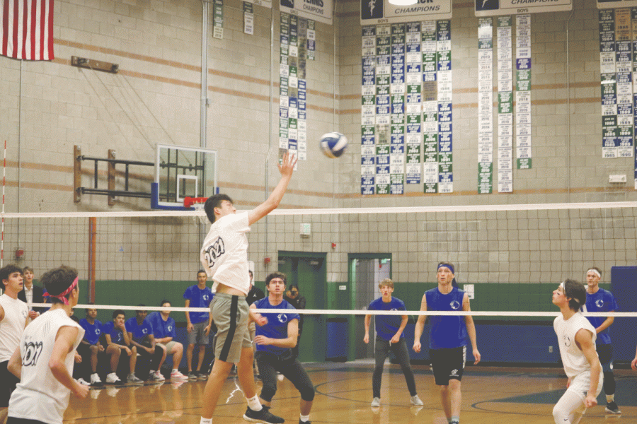 Junior Ian Ferguson passes the ball over to the senior side during the men’s volleyball Buff Puff game. Homecoming week was full of exciting games and assemblies for the Upper School. 