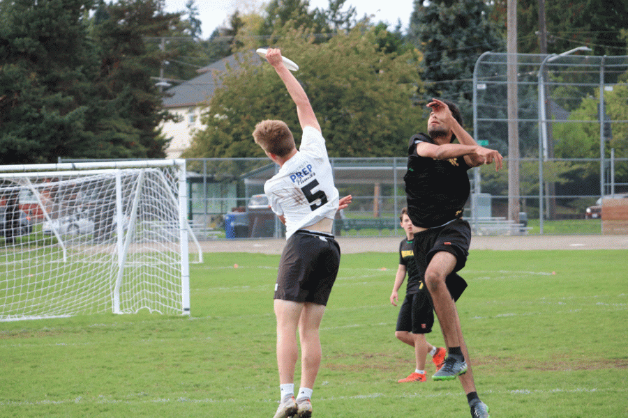Senior Will Turner jumped to catch a disk at a home ultimate game against Overlake. Turner, who has played on national teams, intends to carry his ultimate career into college.