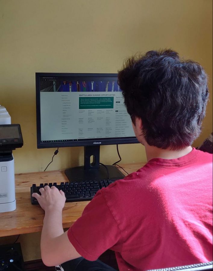 A student sifts through a list of summer programs found on the University Prep website. UPrep has a large assortment of resources available to students for finding summer opportunities.