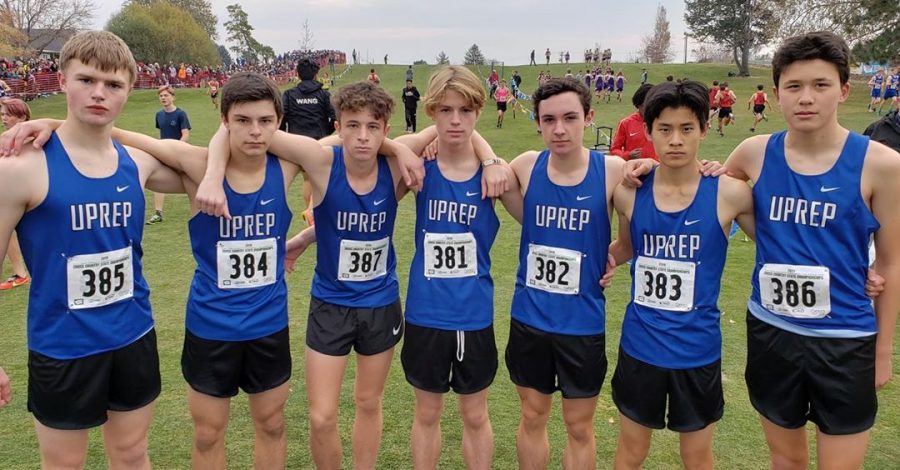 The male runners for UPreps cross country team pose for a photo at last years state championship. Senior Henry Buscher is seen on the far left of the group, with the number 385.