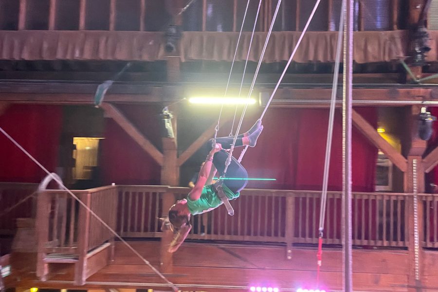 Step 3: tuck knees over trapeze bar