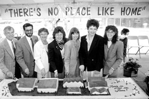 All founders together cutting cake.