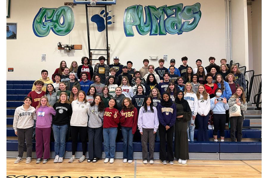 The class of 2023 stands in the Pumadome wearing their college sweatshirts.