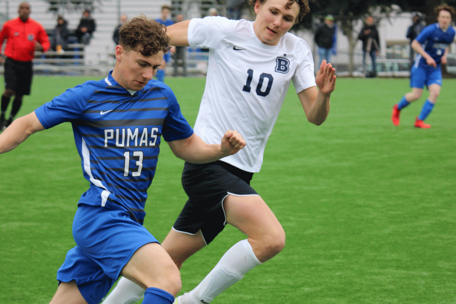 Junior Landon Eintracht dribbles the ball, narrowly escaping his defender early in the second half.