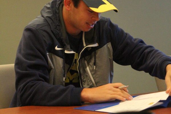 Jackson Ragen signs his letter of intent to play soccer with Michigan.