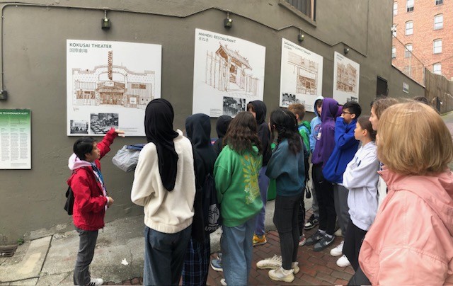 Students learning about China and Japan Town buildings.