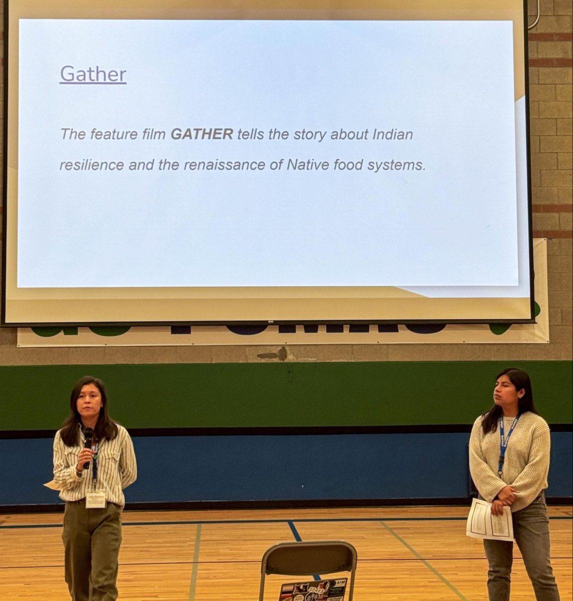 Director of Diversity, Equity, Inclusion, and Belonging, Taylor Kanemori, and Diversity, Equity, Inclusion, and Belonging Program Manager, Flor Hernandez Morales, present during the Indigenous Peoples' Day assembly