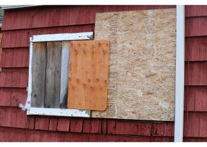 This boarded-up window saw police swarm the building on Oct. 25.