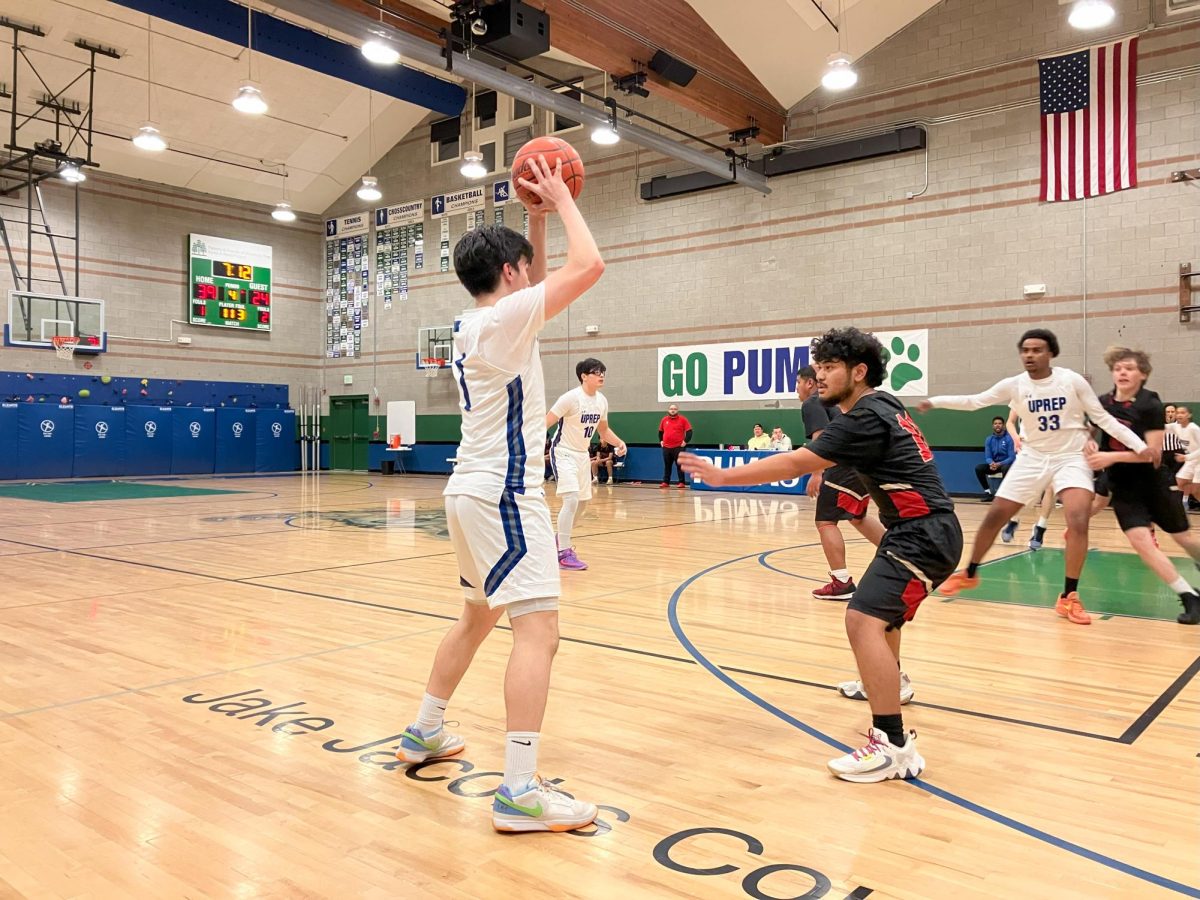 Junior point guard Sol Starin looks to make a pass during the third quarter of the Pumas season opener win against Tyee. 