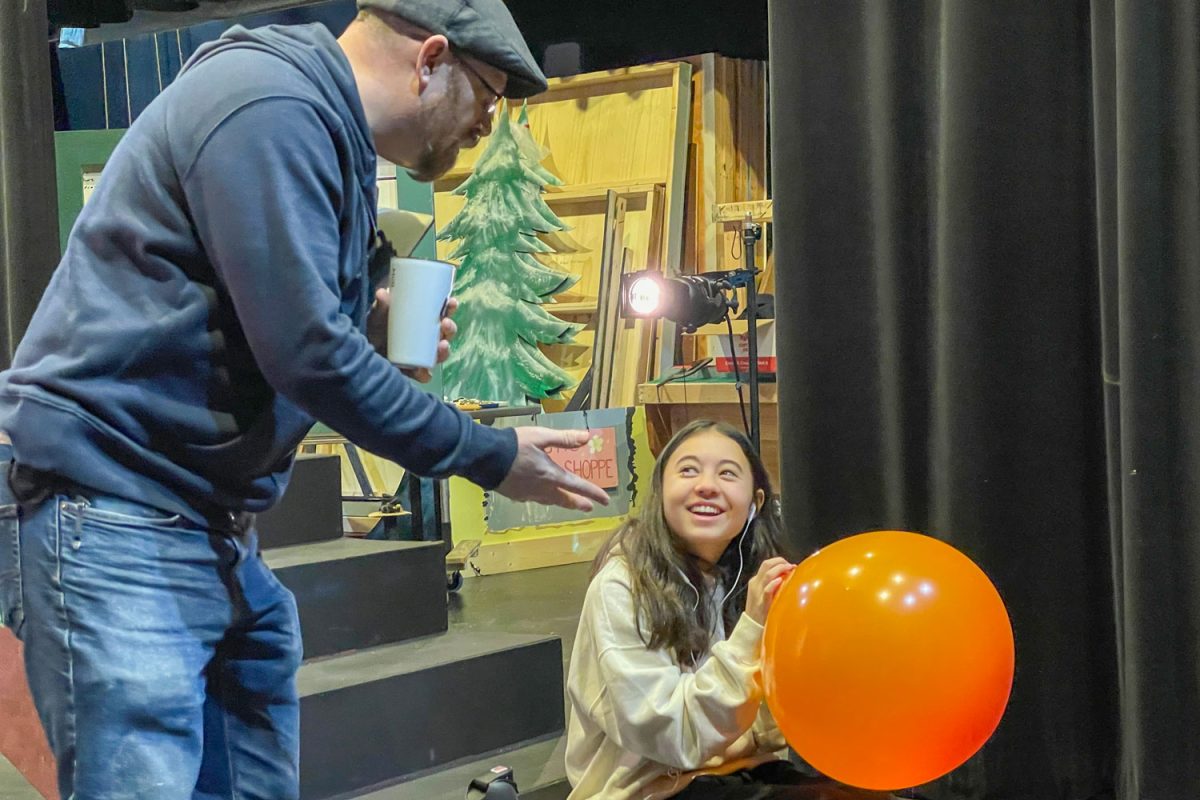 Fine arts teacher Leroy Timblin talks with eighth grader Annabel Margoles in Winter Stock on Jan. 14, 2024.