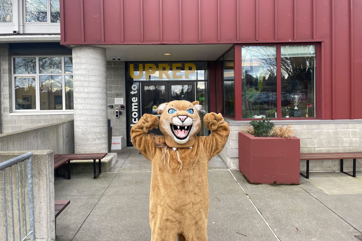 Puma stands outside the front of UPrep