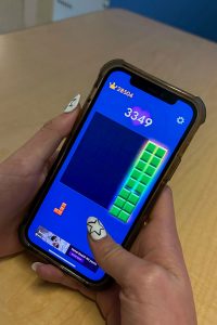 Student plays Block Blast about to clear all blocks.