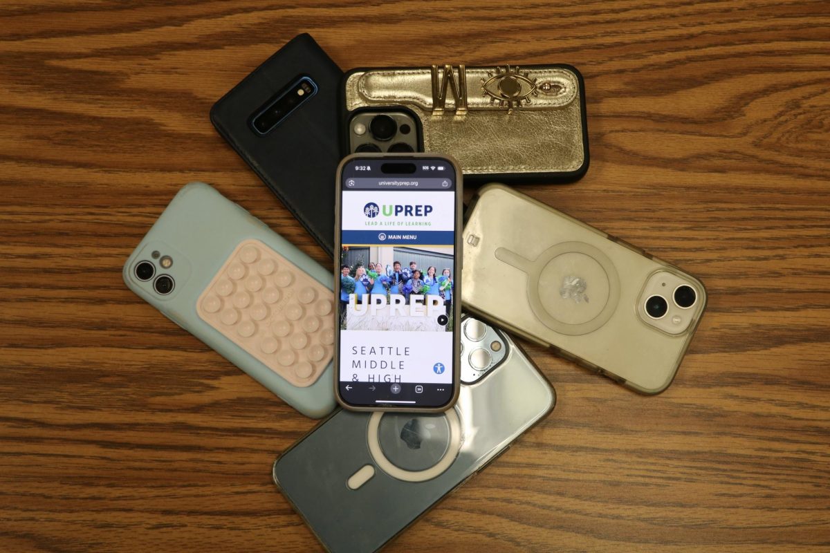 Students phones in a "phone pile" while showing a UPrep logo.