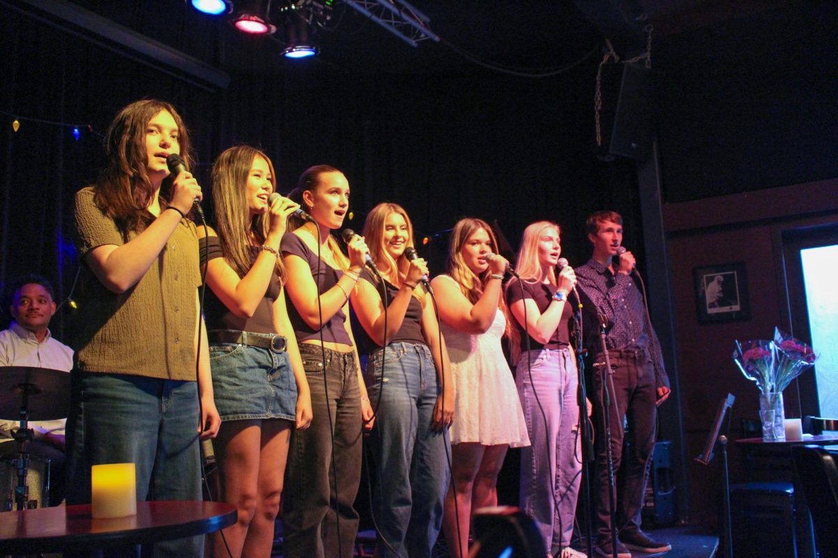 The vocal music class begins their performance by singing “The Water is Wide,” an American folk song.