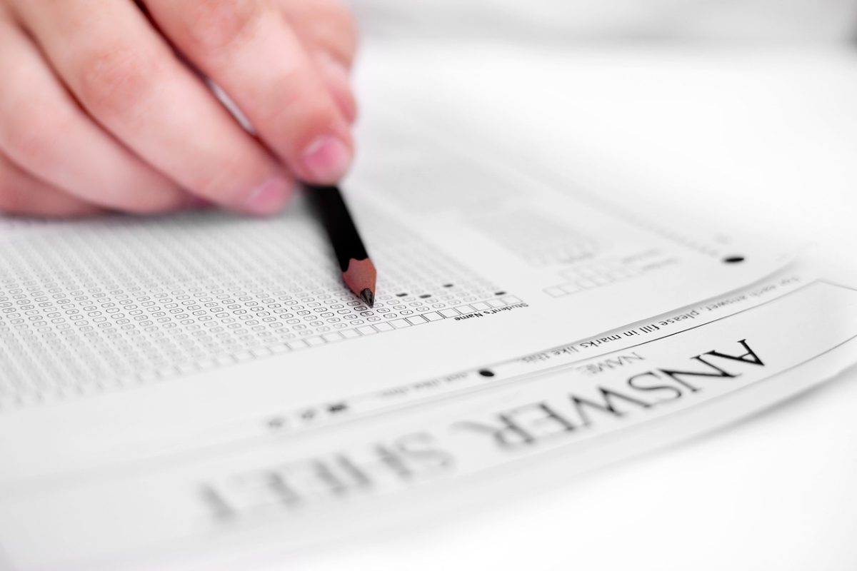 Student fills out a multiple choice exam