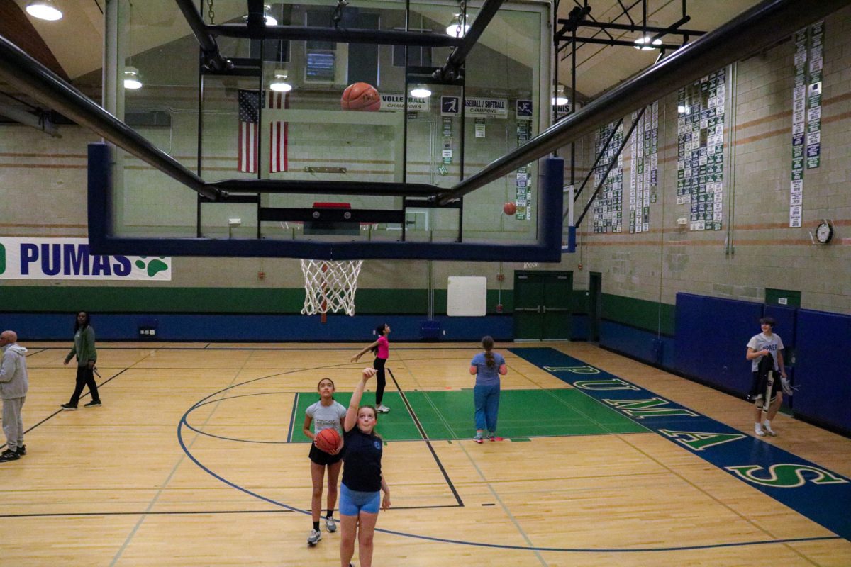 Sixth grader Savannah Stanford takes a shot during a Wednesday Puma League practice as part of a shooting exercise.
