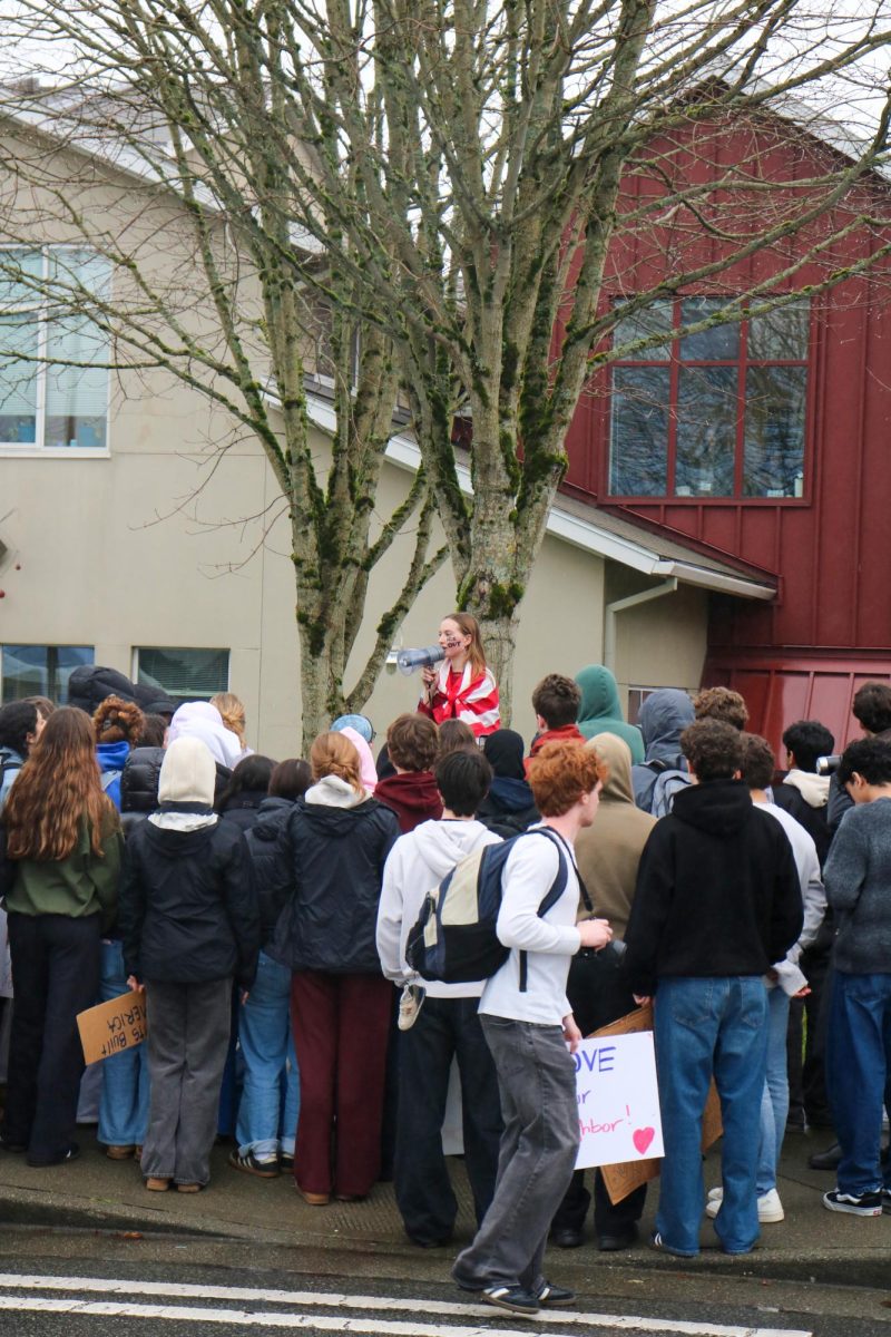 Student protest leader Bryce Hanewall gave a speech to students participating in the walkout in front of the main office. Immediately after the speech, students began to march to University Village