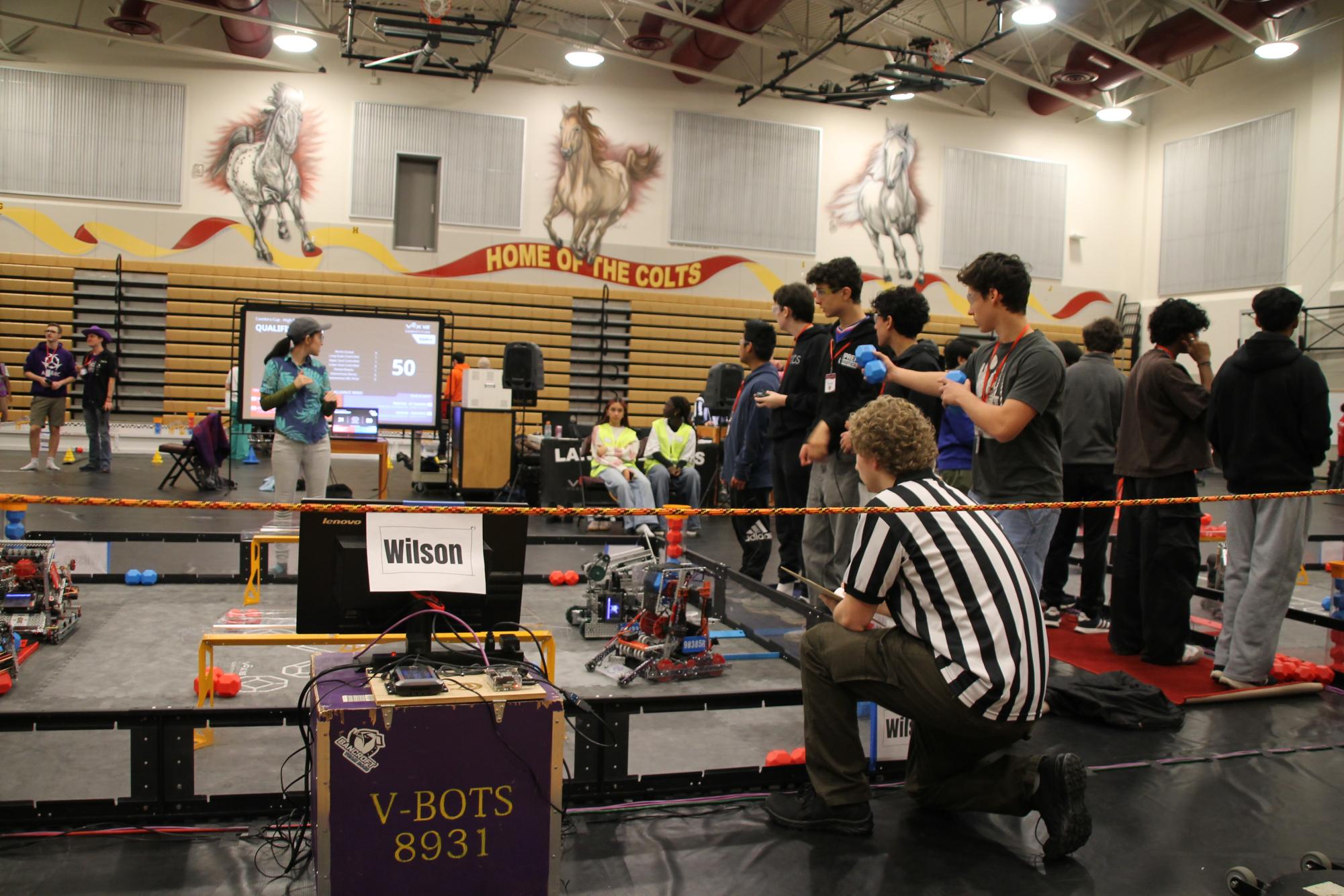Robotics students with their robots during the Cavalero Cup, Feb. 7. Pictured left to right: Peter Kostojohn (sophomore), Rayhan Irani (sophomore), and Cole Simon (sophomore).
