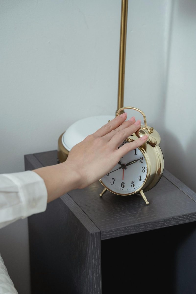 Hand hits alarm clock