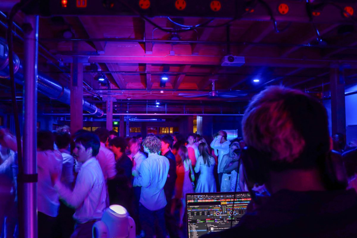 Students dance at the spring formal while the DJ mixes songs. “I like the venue,” said senior Anousha Mukherjee.