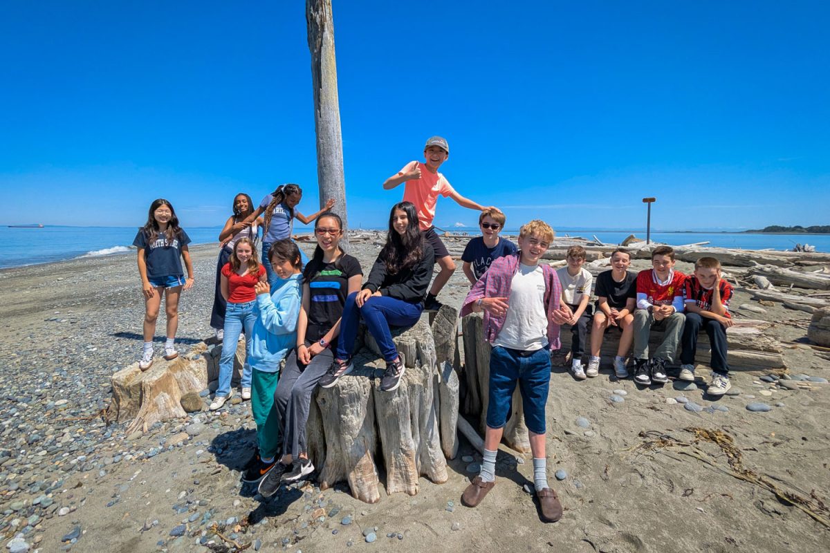 Last year's seventh graders pose for a photo on the beach in Neah Bay, Washington. They would be among the last to take such a trip.