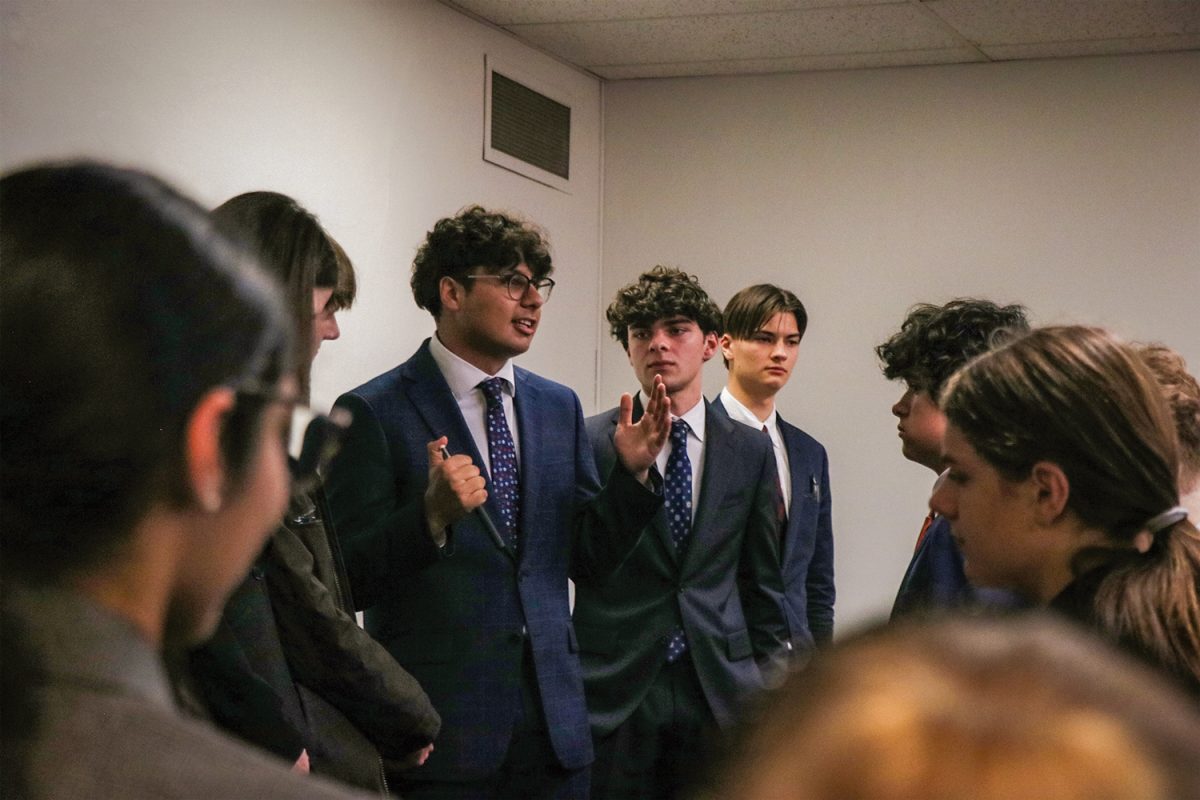 Aslan Malik speaks to the mock trial team at districts in February in Kitsap County. 